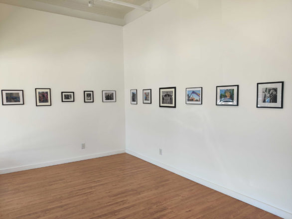 Installation view of photographs hanging in an art gallery.